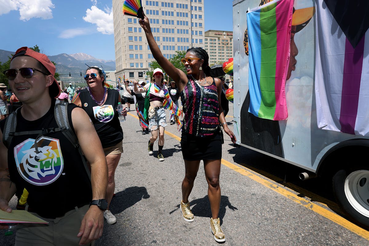 Interim Pres. Dr. Manya Whitaker, staff, faculty, alumni and others, marched in the Pikes Peak Pride parade on June 15 Downtown Colorado Springs. Photo by Jamie Cotten / Colorado College